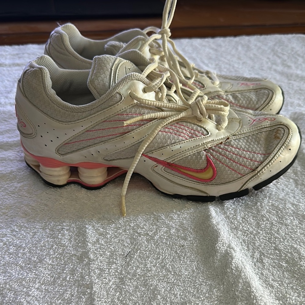 Nike  used Athletic Shoes with Cushioned Sole white pink accents size 9